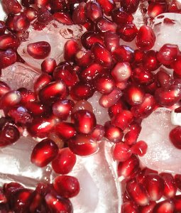 pomegranate seeds on ice