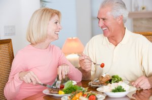 man and woman enjoying a healthy meal
