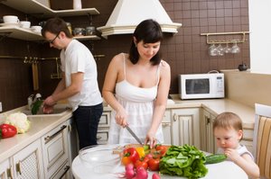 family preparing a healthy salad