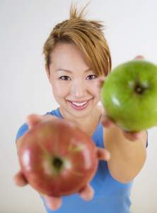 healthy eating woman offering apples