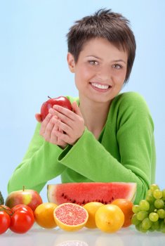 healthy woman eating fruit