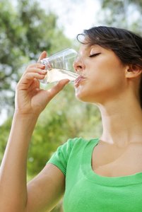 woman drinking a glass of water