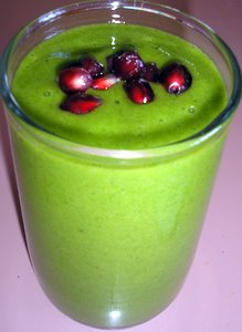 green smoothie with pomegranate seeds